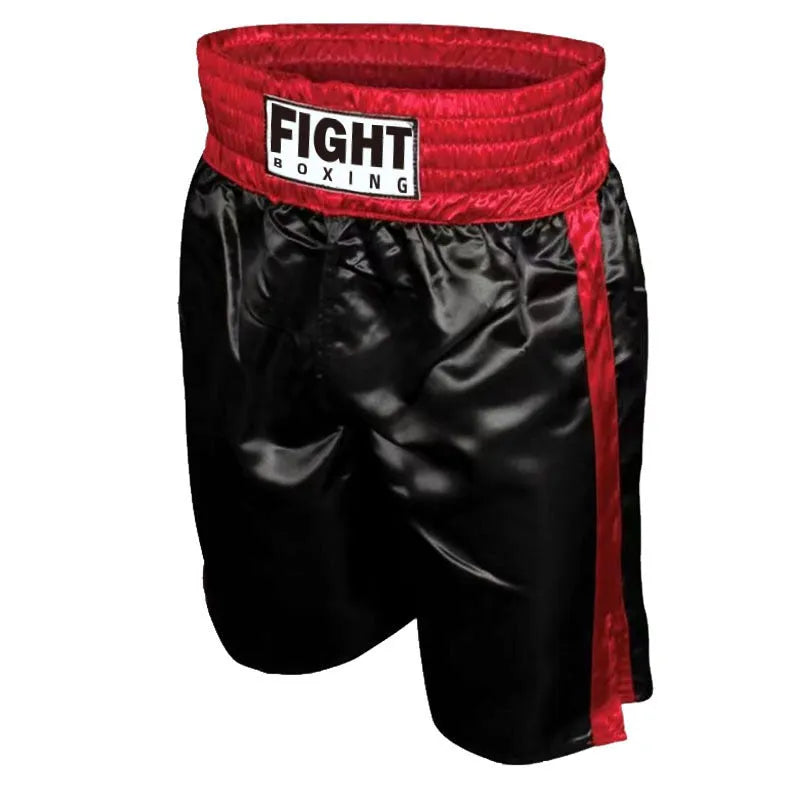 Man wearing black and white boxing shorts with side stripes during a training session