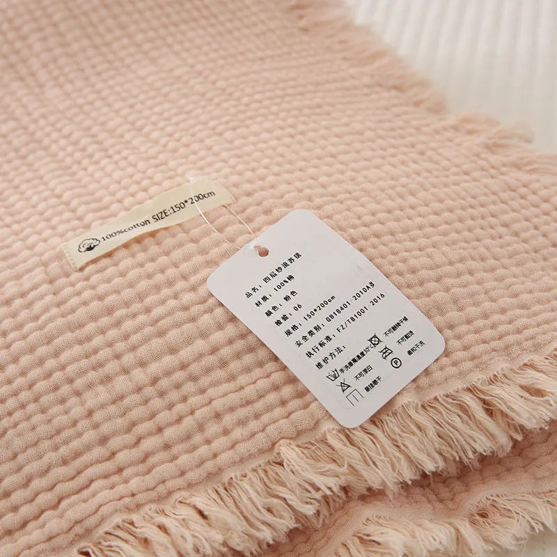 Four-layer gauze cotton blanket with tassel detailing in navy blue colour option