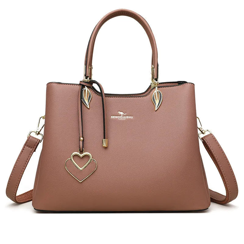 Women's black PU leather shoulder messenger bag with multi-layer compartments and visible stitching details