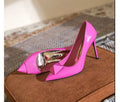 Pink patent leather women's pointed toe stiletto high heels with buckle and rivet detail