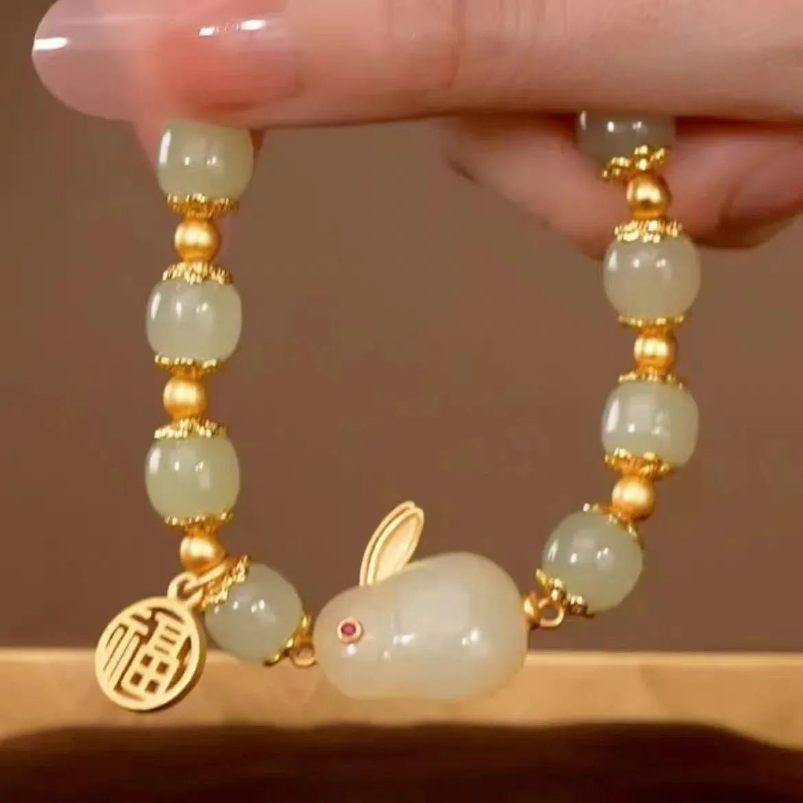 Green fu hare jade pendant on black elastic women's bracelet