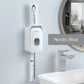 Automatic toothpaste dispenser mounted on bathroom wall in blue colour