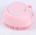 Blue silicone dog bath brush with rubber fingertips for pet grooming during bath time