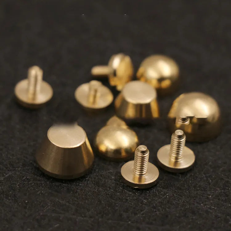 Brass decorative buckle with geometric and round foot nail designs in 10x6mm and 12x7mm sizes.