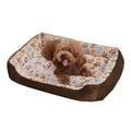 Beige plush sofa-style pet bed for a small dog, showing bolstered sides and padded construction.
