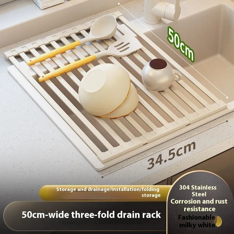 Milky white foldable stainless steel kitchen draining rack shown next to a sink.