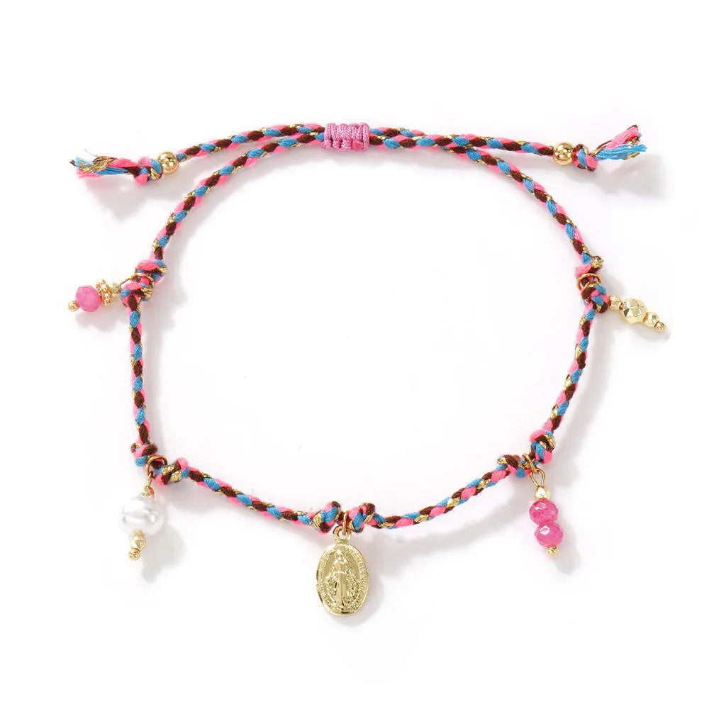 Close-up of a hand-woven colourful braided rope bracelet for women with a carrying strap tag.