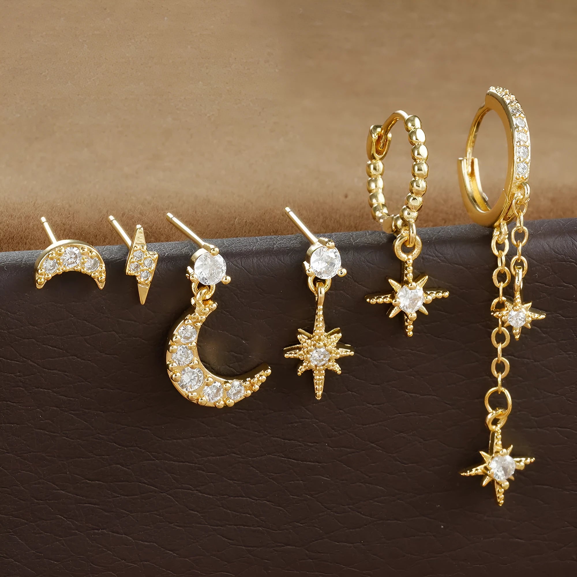 Six gold-plated zircon stud earrings with chain and tassel pendant designs for women