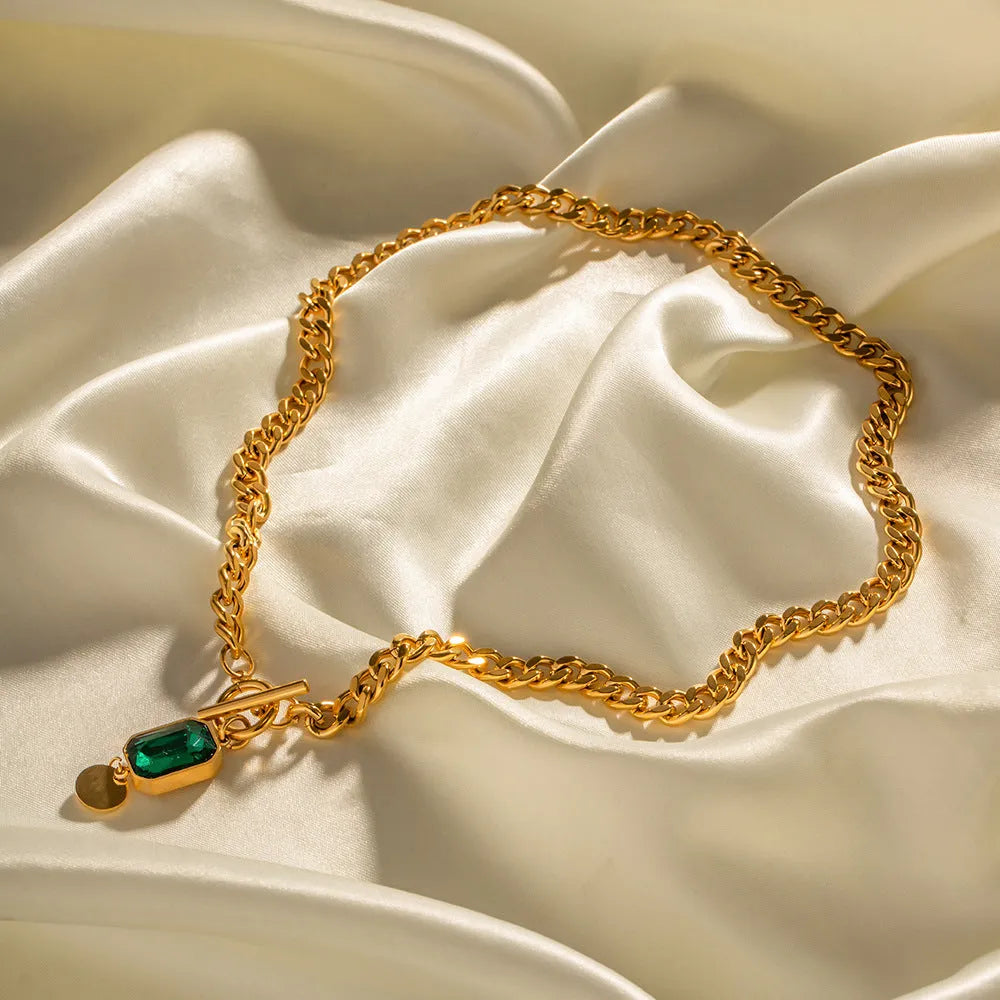Gold electroplated titanium steel necklace with geometric round pendant on Cuban link chain