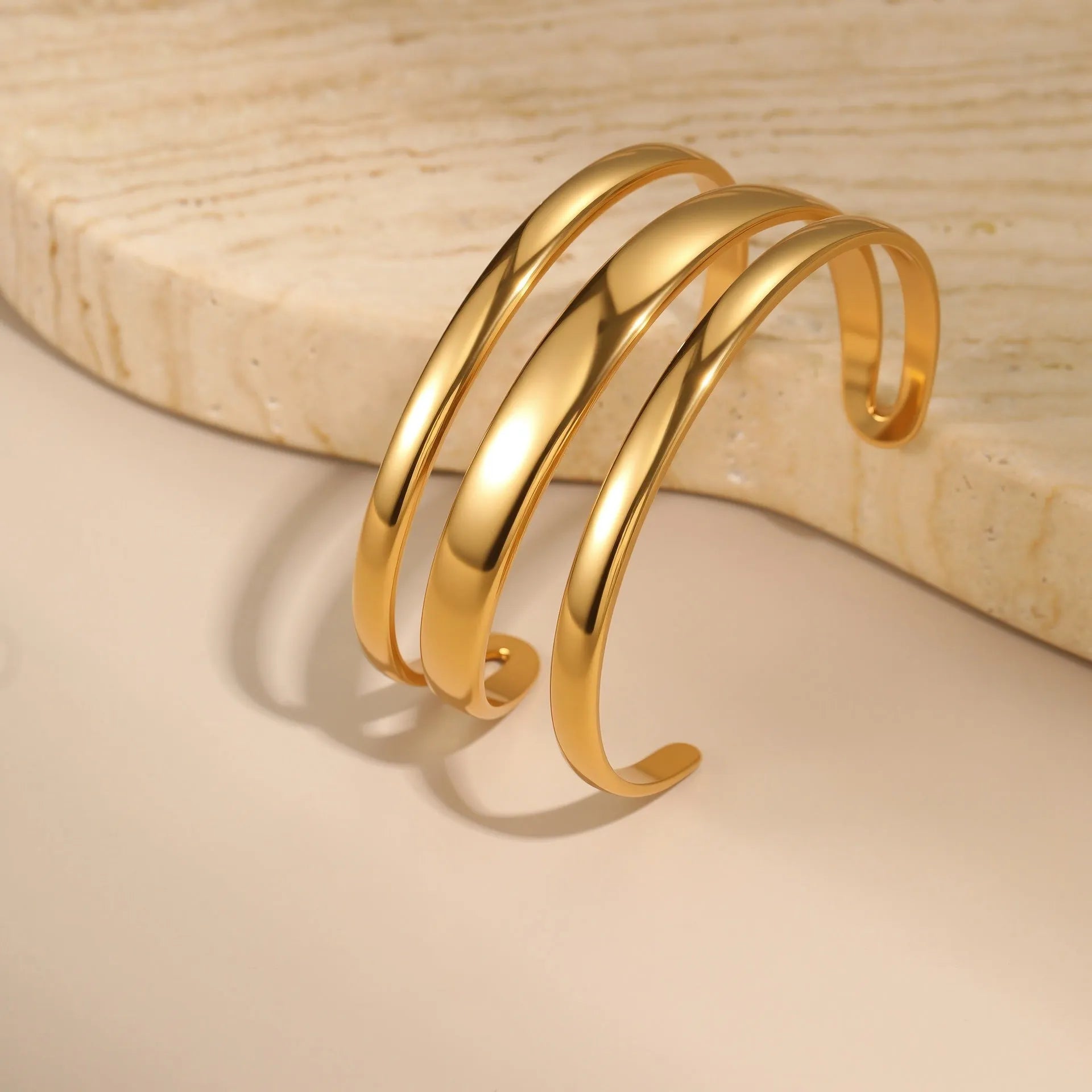 Women's geometric stainless steel bracelet with 18K gold electroplating in simple opening design