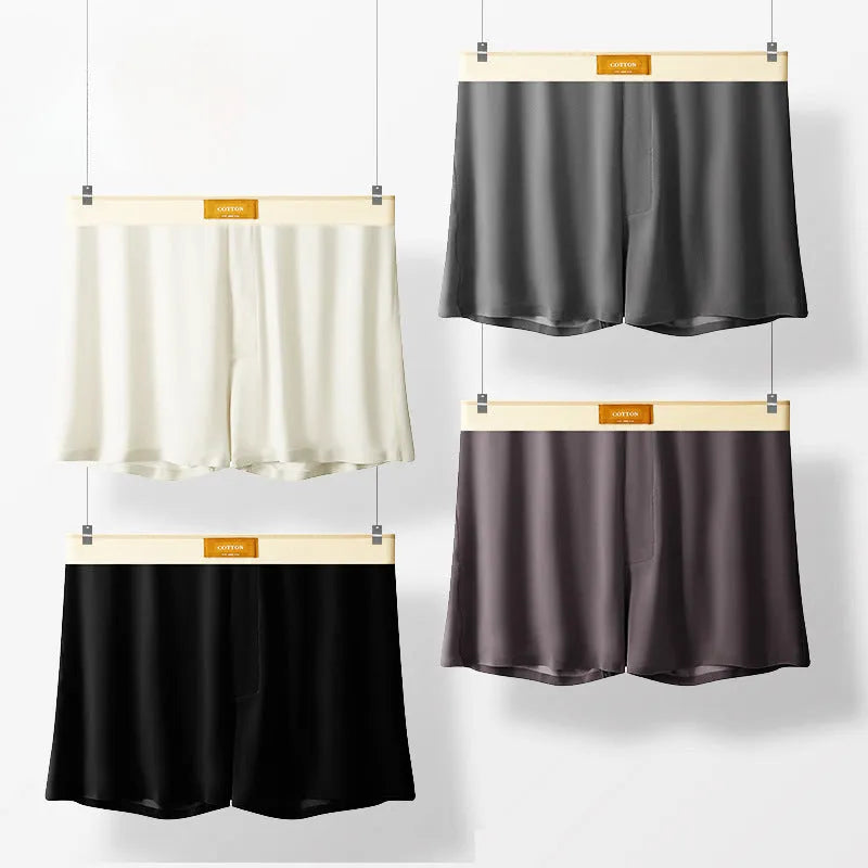 Pack of three pairs of men's solid colour ice silk underwear on a white background.