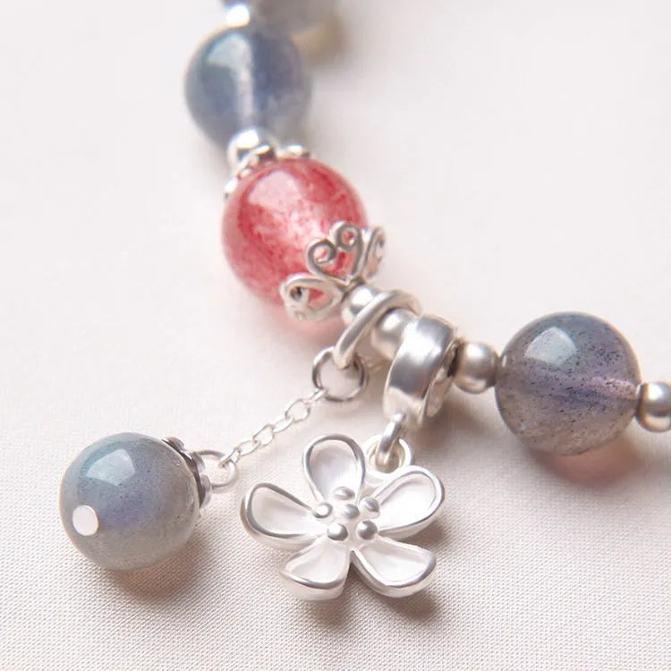 Women's 925 silver bracelet with grey moonlight stones and a honeysuckle animal charm.