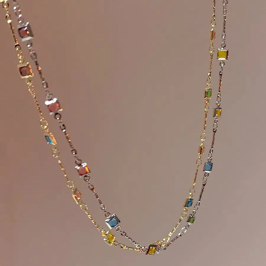 Square colour clavicle chain necklace with geometric quadrilateral crystal elements in gold and white K finishes