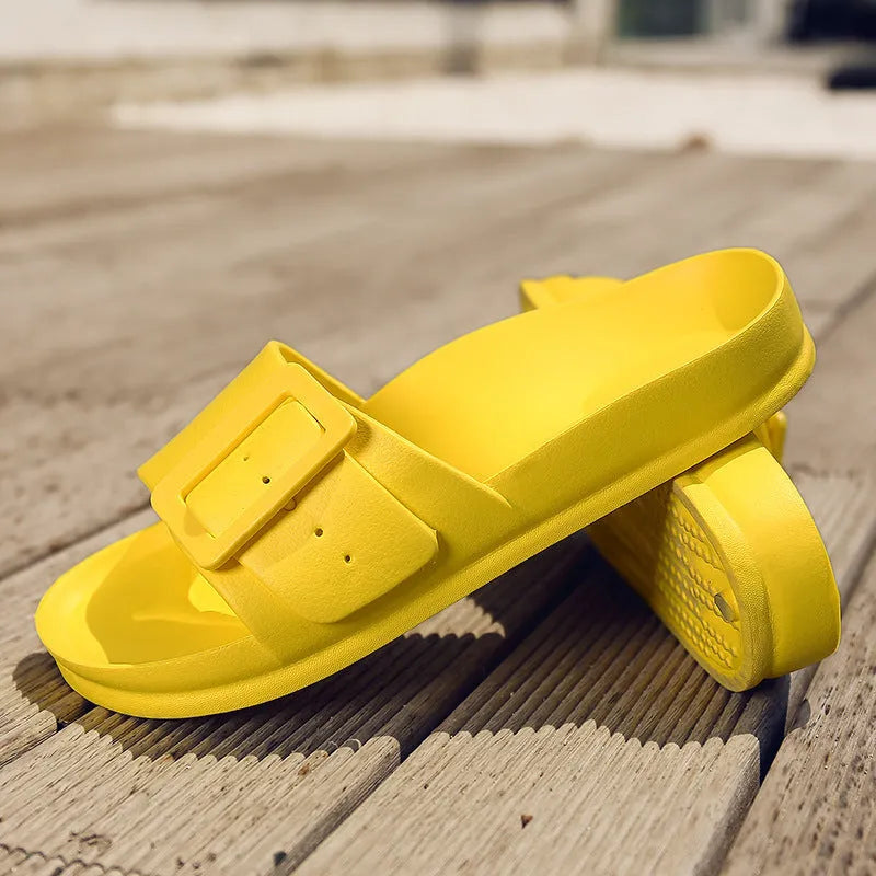 Women's grey blue flip-flop slippers with a buckle strap on a soft EVA sole.