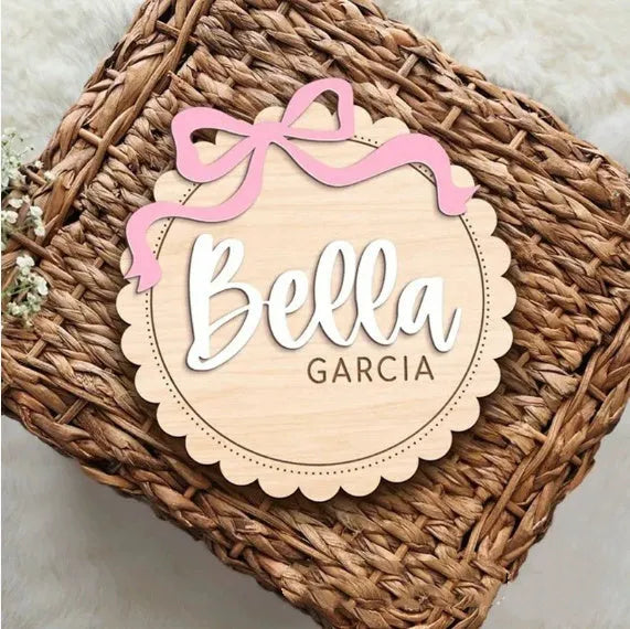 Square wooden ornament laser-engraved with a custom name for baby room decoration.