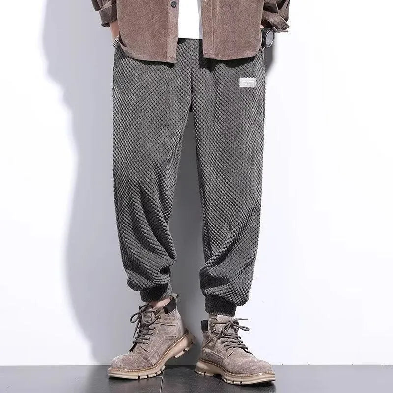 Men's grey ankle-tie casual sweatpants with straight leg design on hanger