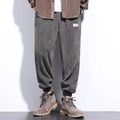 Men's grey ankle-tie casual sweatpants with straight leg design on hanger