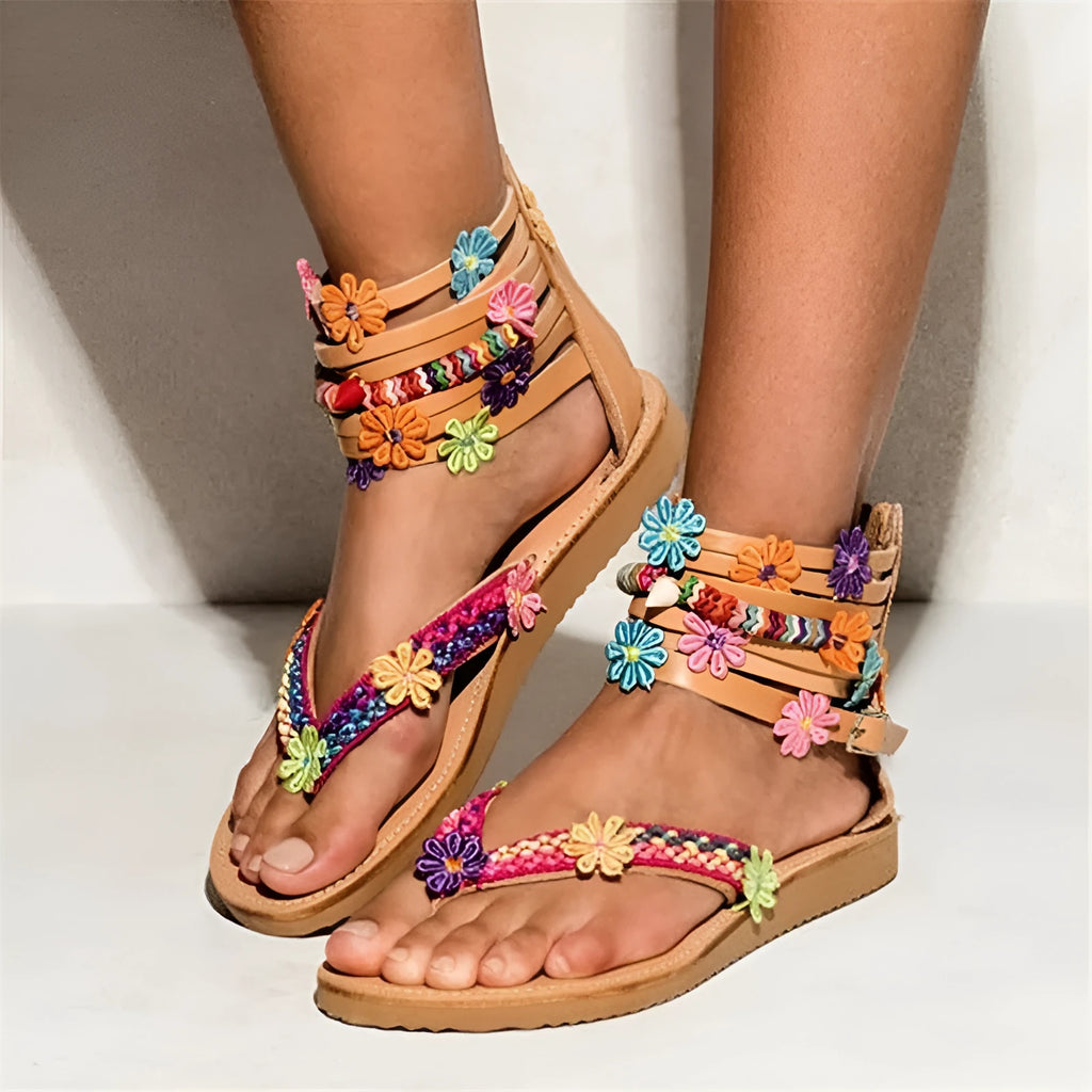 Ethnic beaded petal and flower decoration on artificial PU Roman sandals with a round toe.