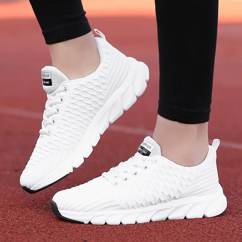 Women's running shoes in black pink white colours with fly weaving upper and wear-resistant outsole