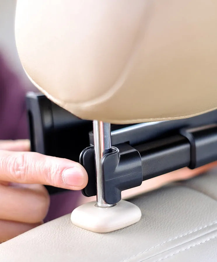 Black plastic car phone holder with universal tablet compatibility mounted on vehicle rear seat