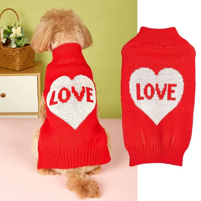 Red and pink dog sweater with love heart and bow design on a small dog.