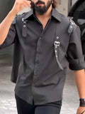 Men's black utility-style button-up shirt with regular fit on mannequin