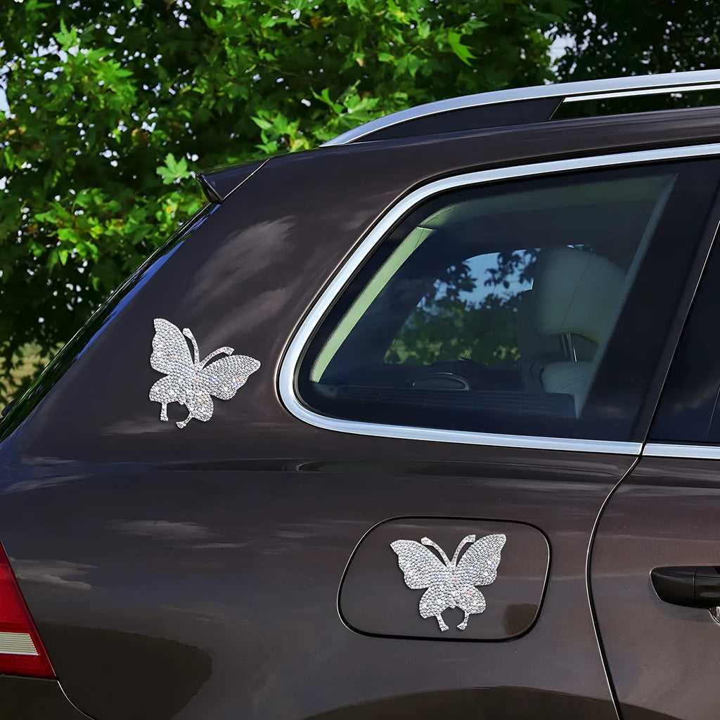 Diamond-encrusted glass car sticker showing butterfly and bear paw designs, scale next to a 7x6 cm measurement.