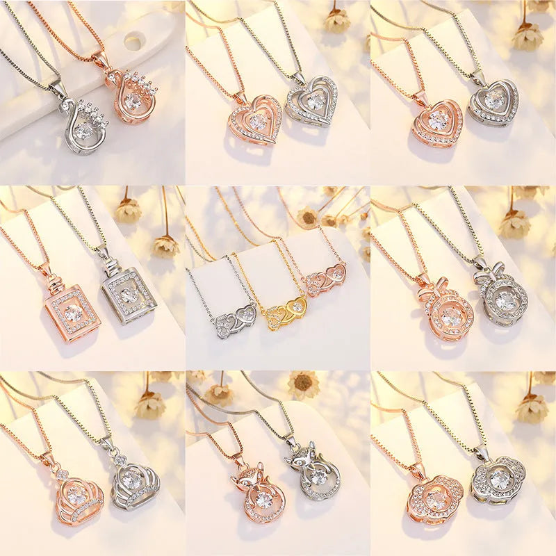 Silver love heart-shaped necklace with crown and bow decoration on clavicle