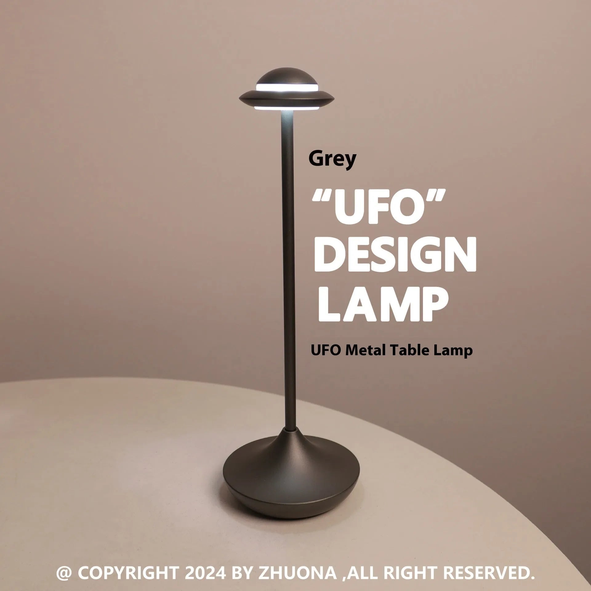 Gold UFO-shaped metal table lamp with touch dimming controls on a desk.