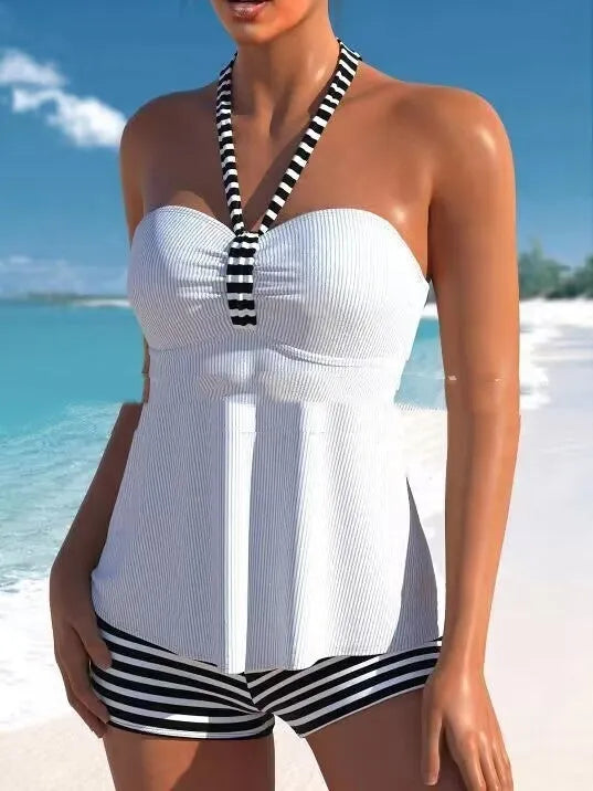 Women's off-shoulder swimsuit in black and white stripes and solid colours