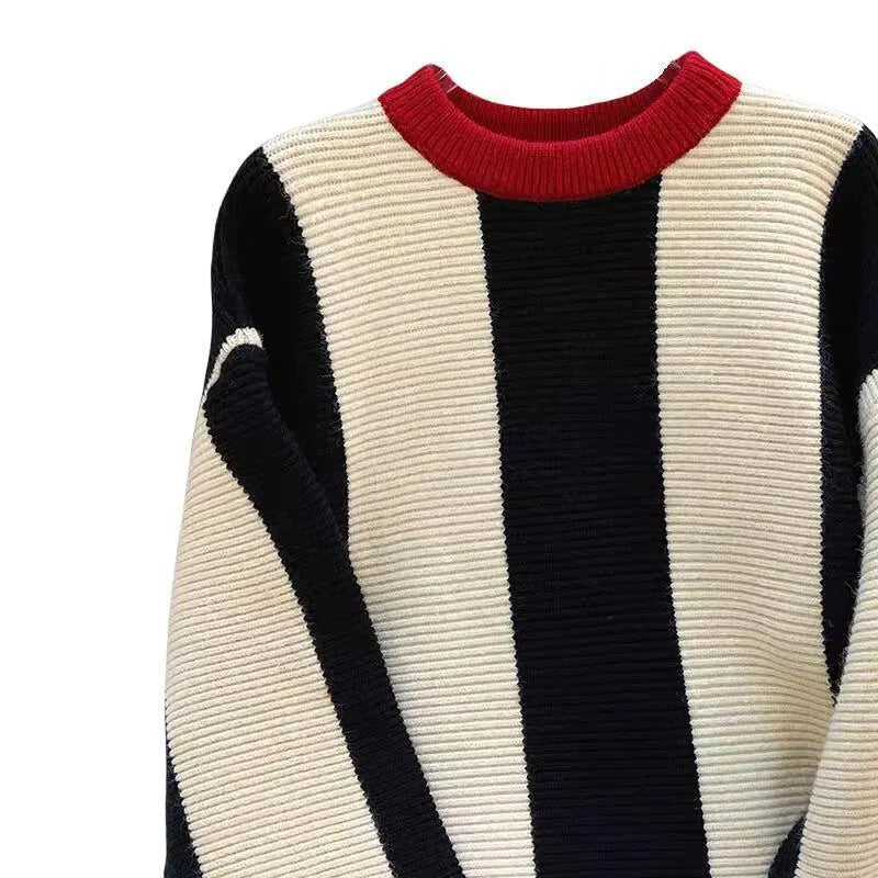 Women's striped cashmere knitted pullover sweater in contrasting colours with a round neck.
