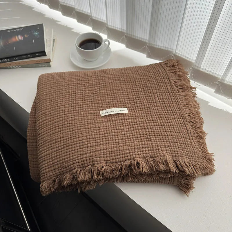 Four-layer gauze cotton blanket with tassel detailing in navy blue colour option