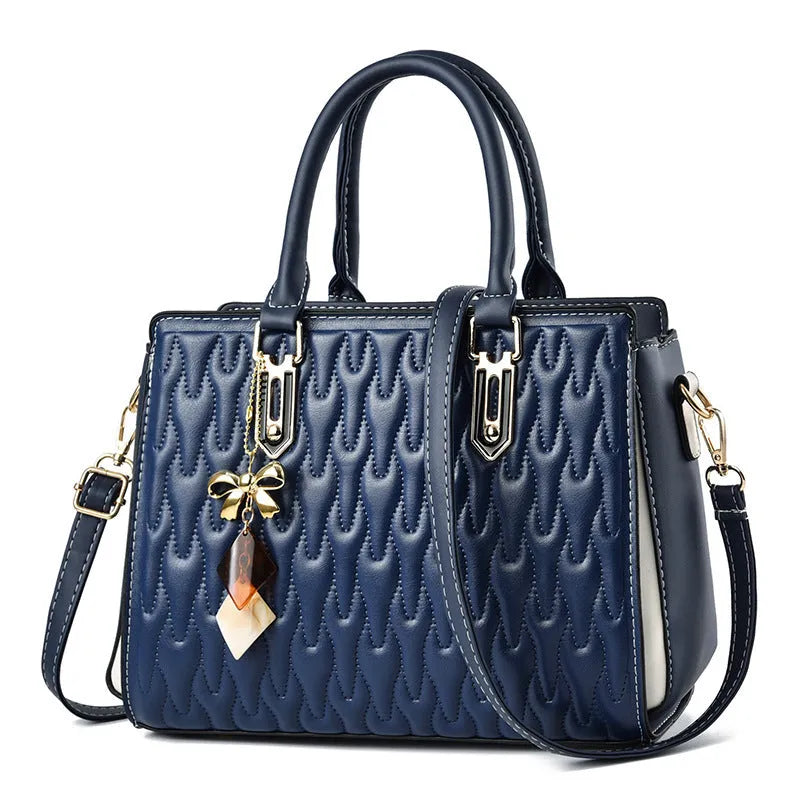 Women's large polyester messenger bag in black with shoulder strap and external pockets.