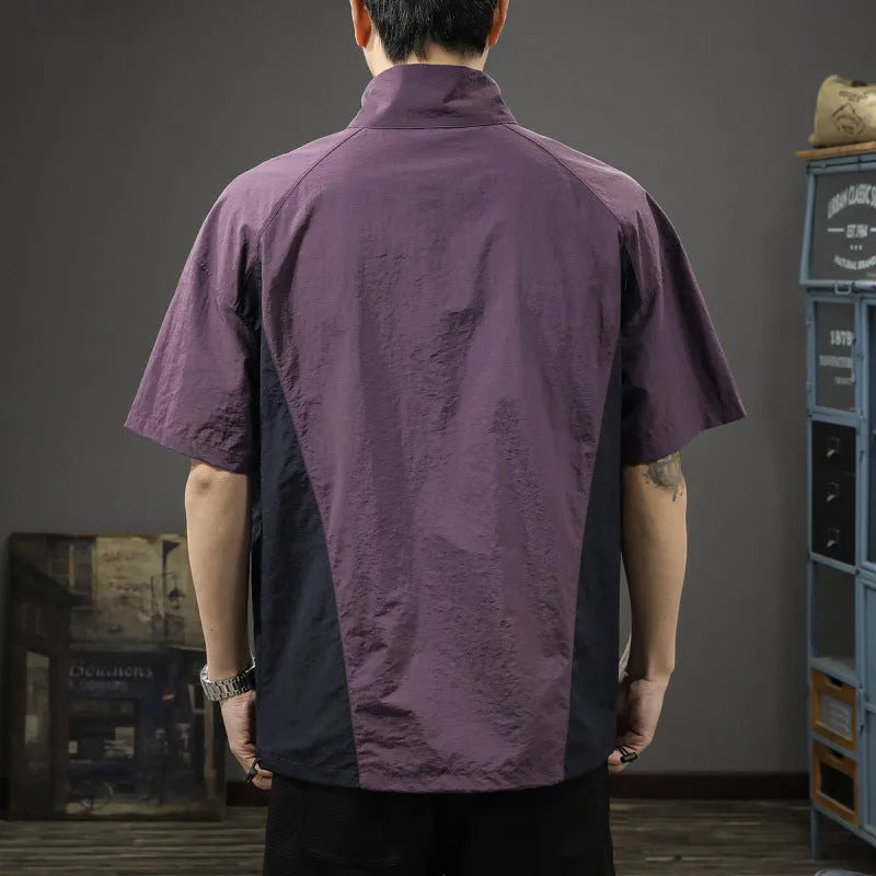 Brown men's half-zip stand collar short sleeve casual shirt laid flat, showing fleece lining and loose fit.