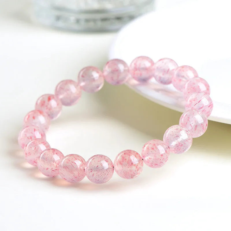 Strawberry quartz crystal bracelet with 10-10.8mm round beads in white water colour