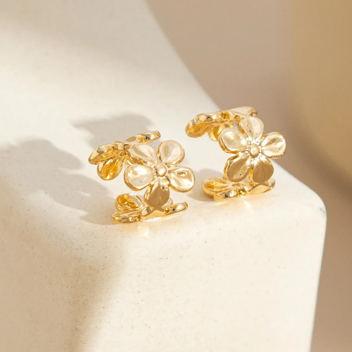 Gold starfish and conch drop earrings for women with electroplated alloy construction