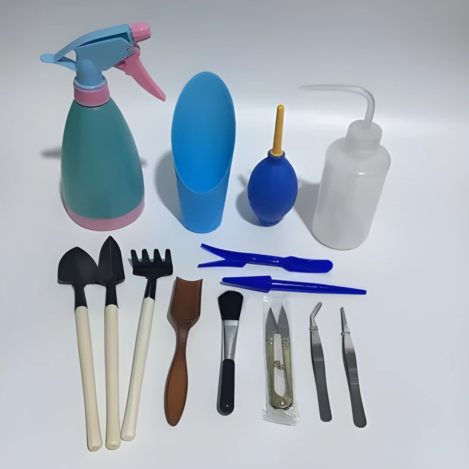 14-piece succulent gardening tool set showing watering can, mini tools, tweezers, and air blower for small plant care