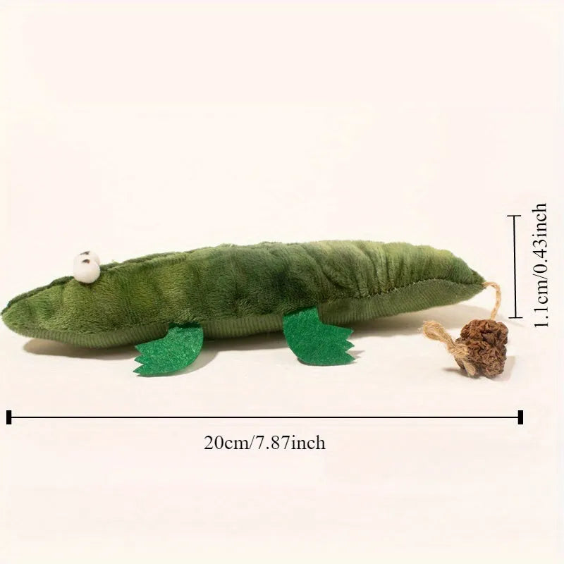 Green plush alligator catnip toy made from cotton fabric on a plain background.