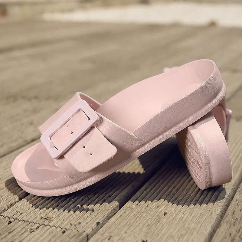 Women's grey blue flip-flop slippers with a buckle strap on a soft EVA sole.