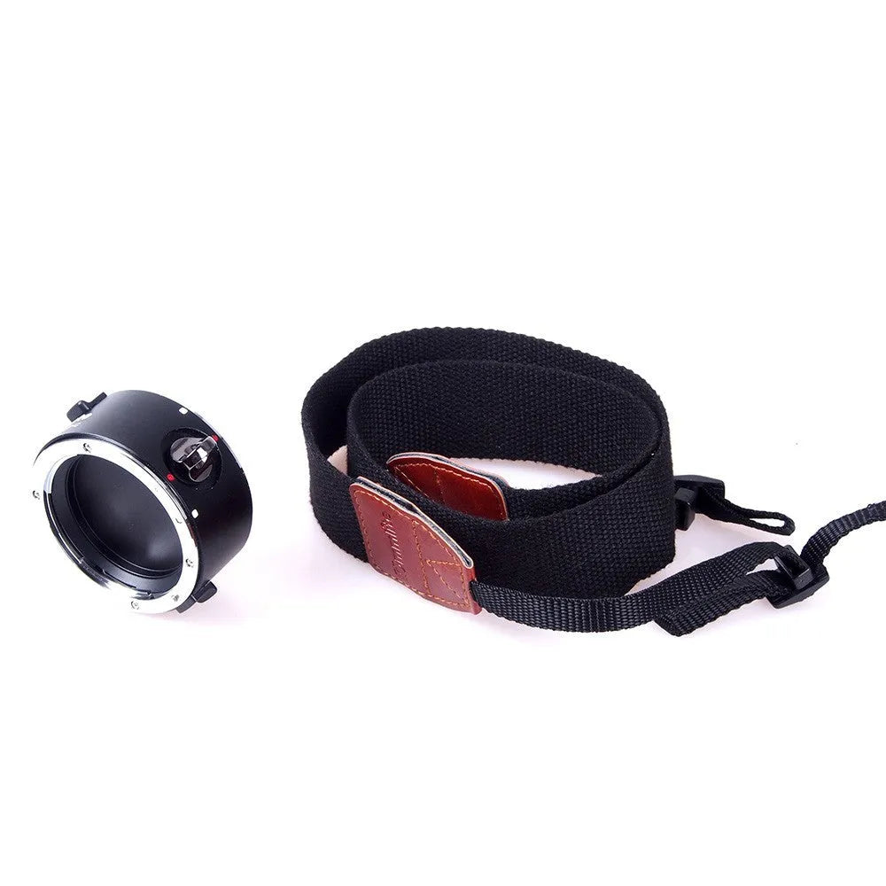 Aluminium lens flipper for Nikon E-Mount cameras with cotton shoulder strap showing double lens holder design