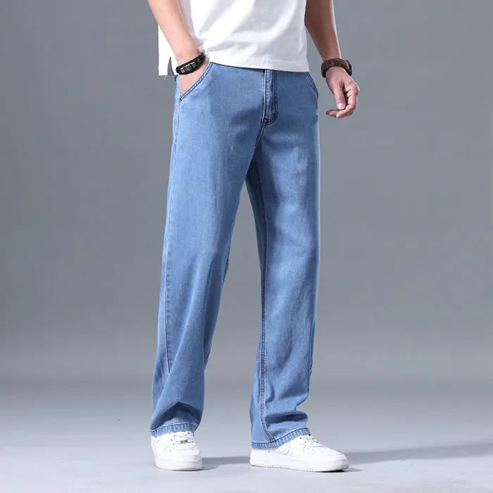 Men's straight leg loose fit lyocell jeans in blue and grey shades with zipper fly