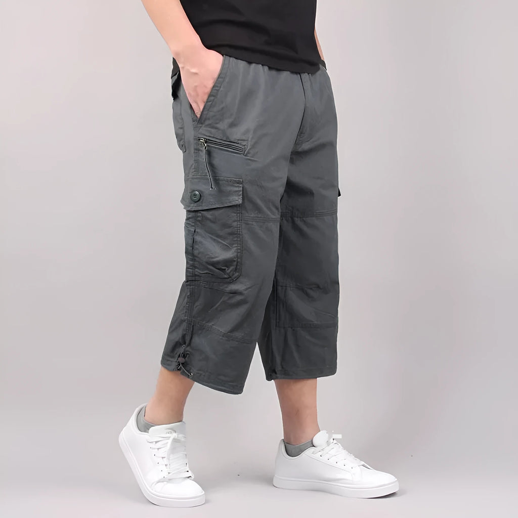Men's loose-fit cotton cropped casual pants in army green colour on a white background