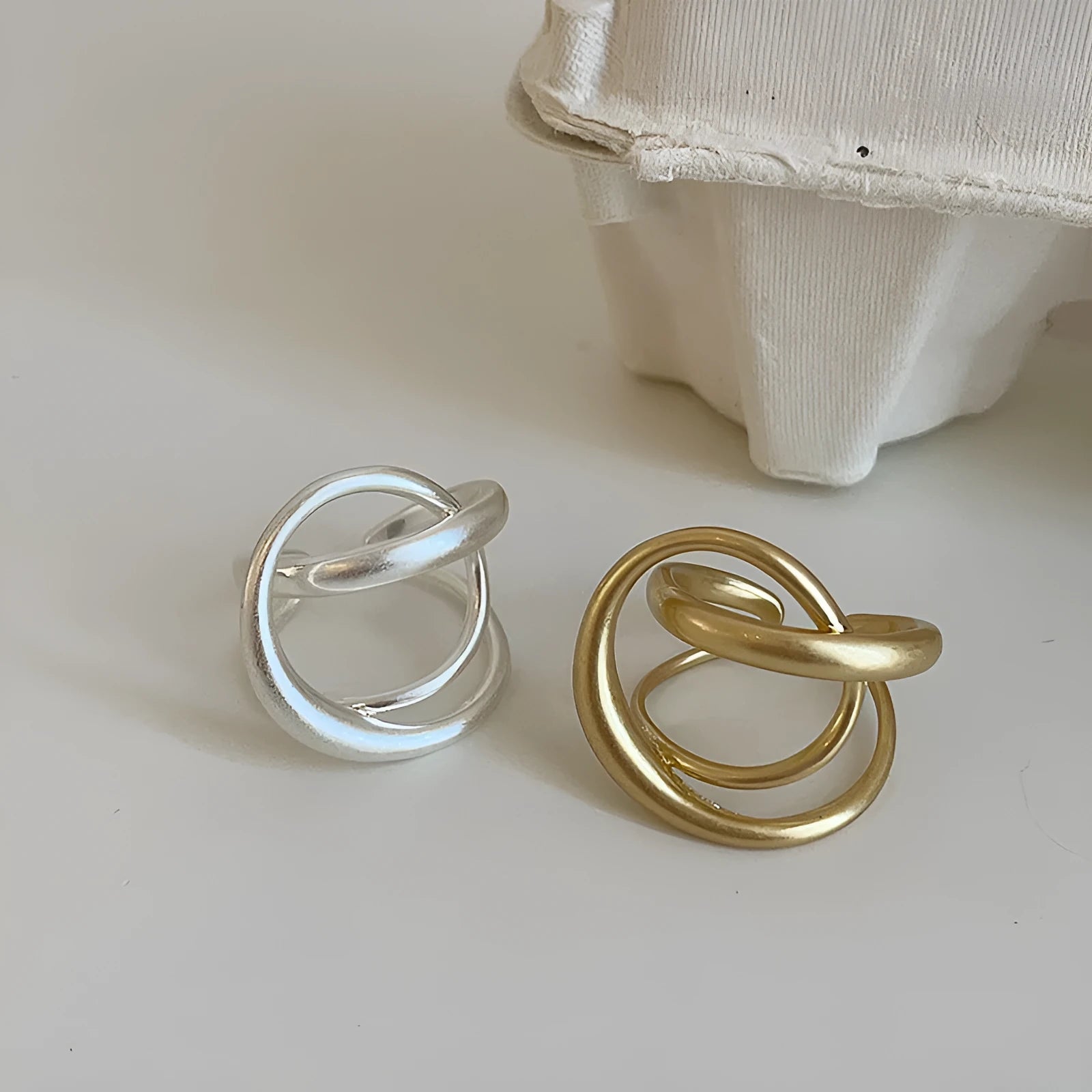 Geometric open ring for women with interlaced matte metal design and real gold plating