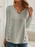 Men's solid colour buttoned knitted sweater on a hanger, showing grey green option.