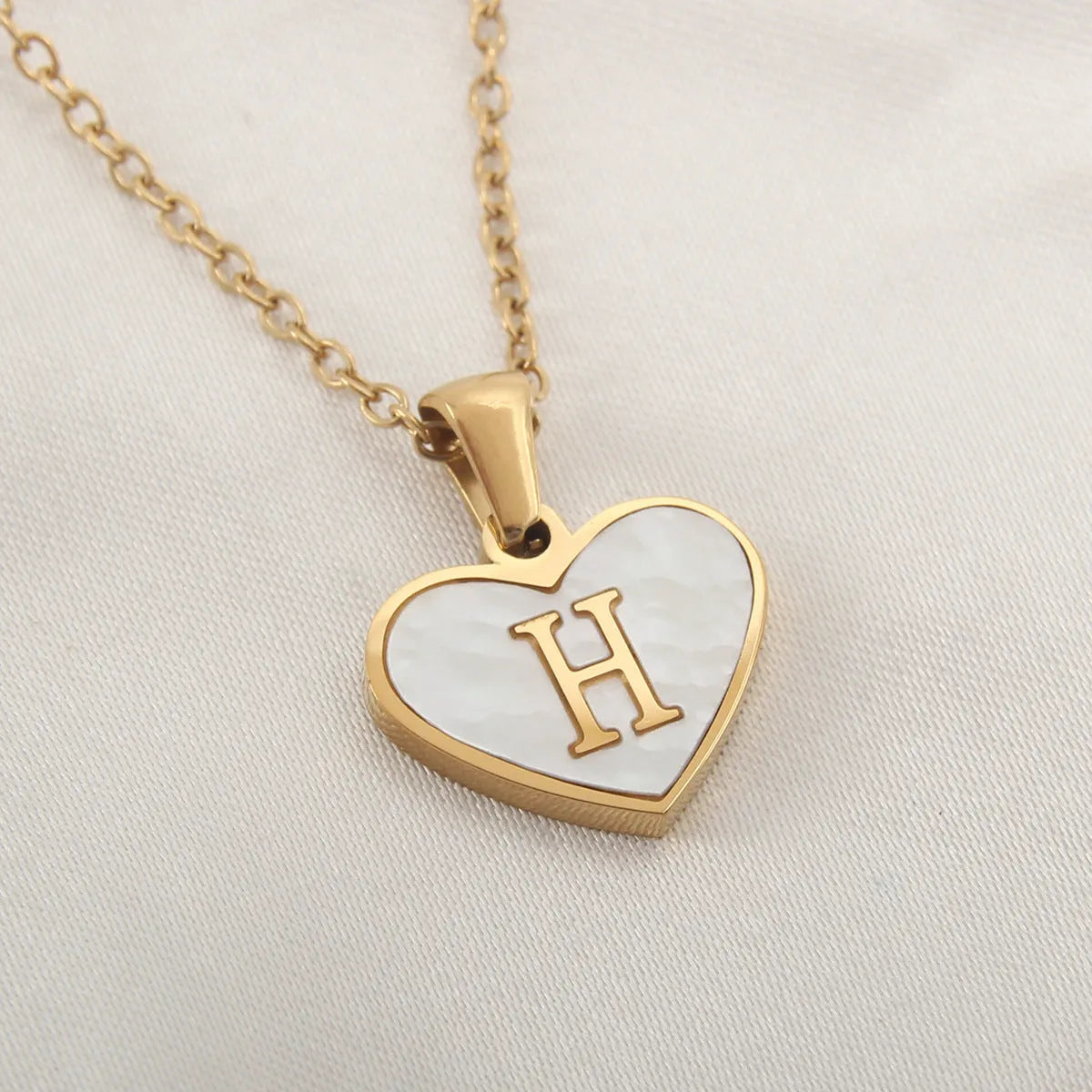 Gold plated personalised heart necklace with white shell on a 45cm chain
