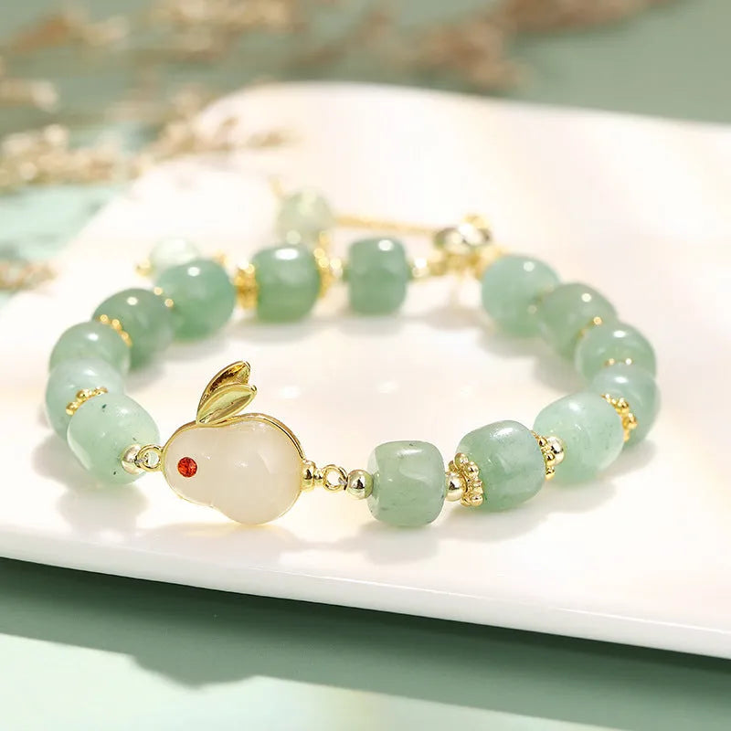 Women's rabbit charm bracelet with natural stone beads and gold accents
