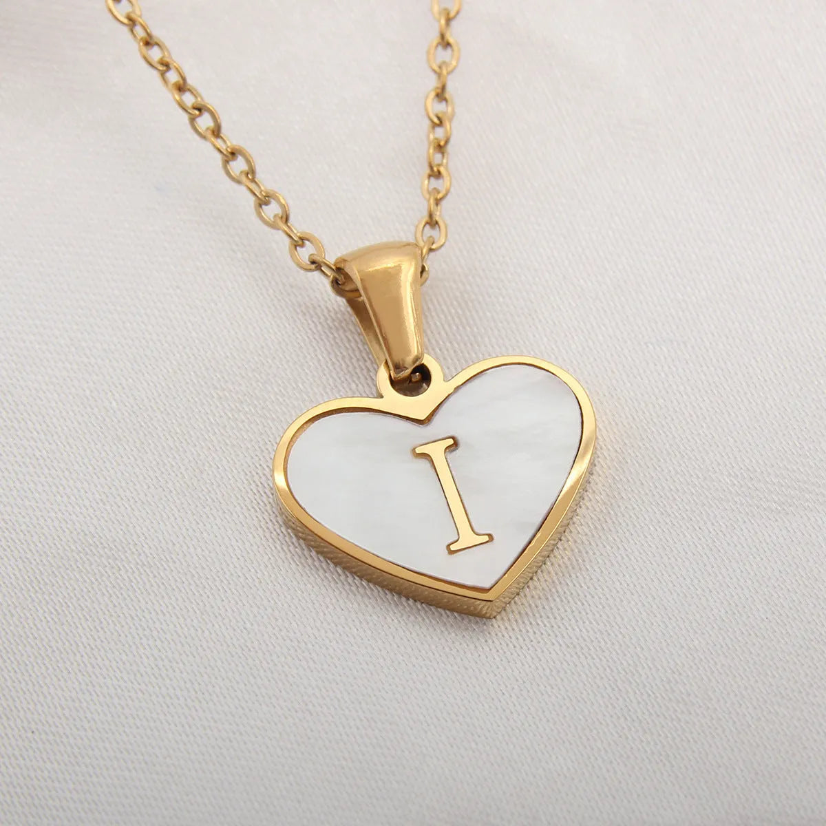 Gold plated personalised heart necklace with white shell on a 45cm chain