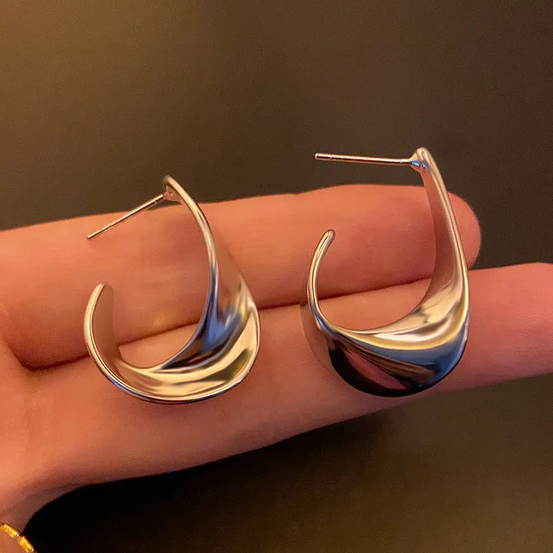 Geometric twisted metal earrings in gold or silver electroplated finish