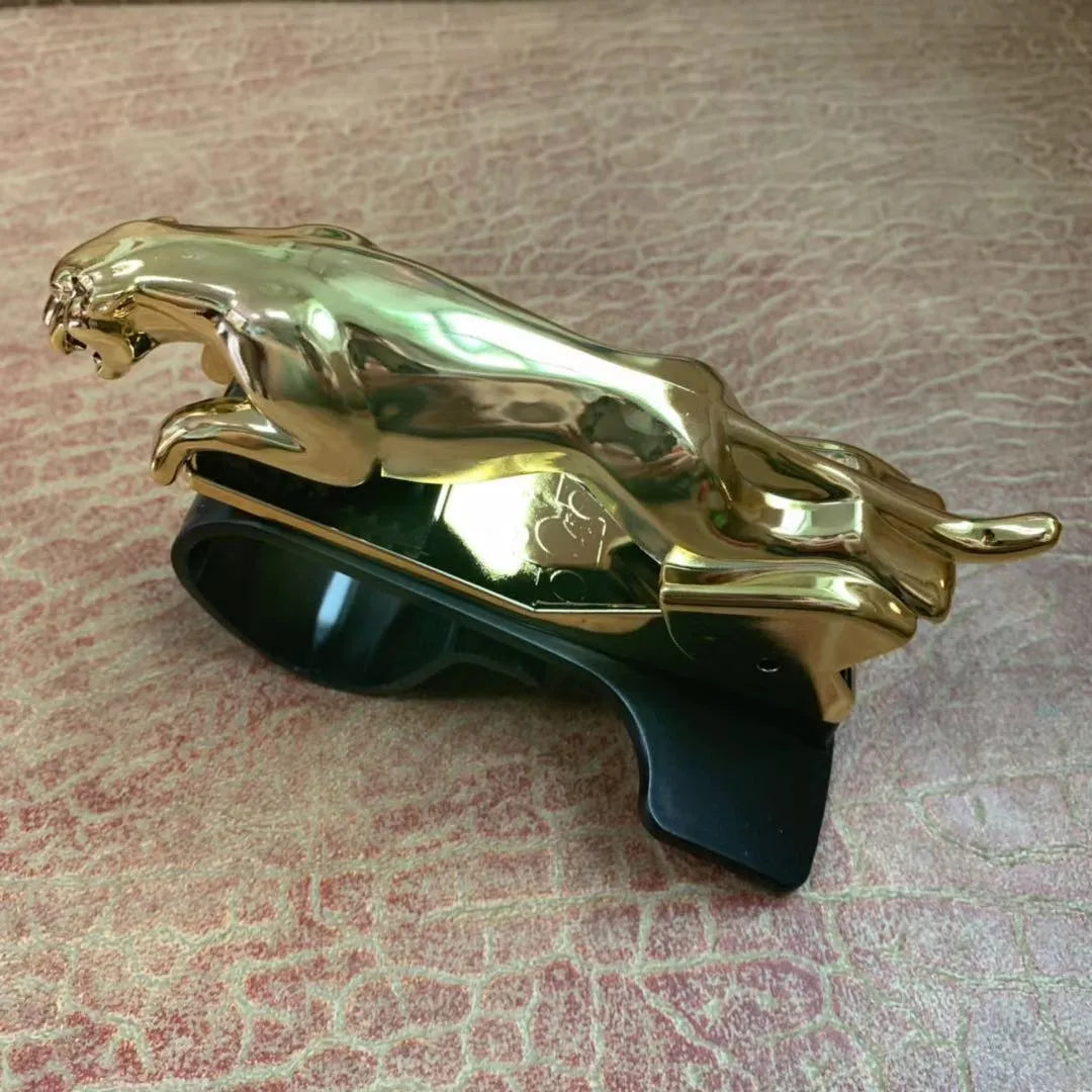 Car Leopard brand rotatable mobile phone holder in black on a car dashboard.