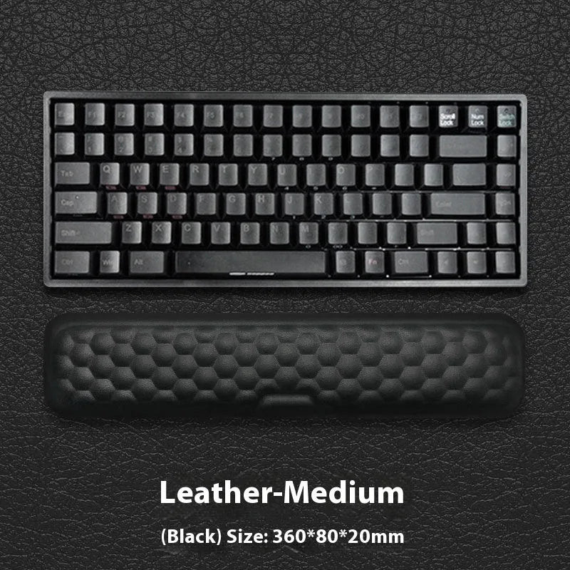 Customisable memory foam mouse wrist pad with black cloth cover on a desk.